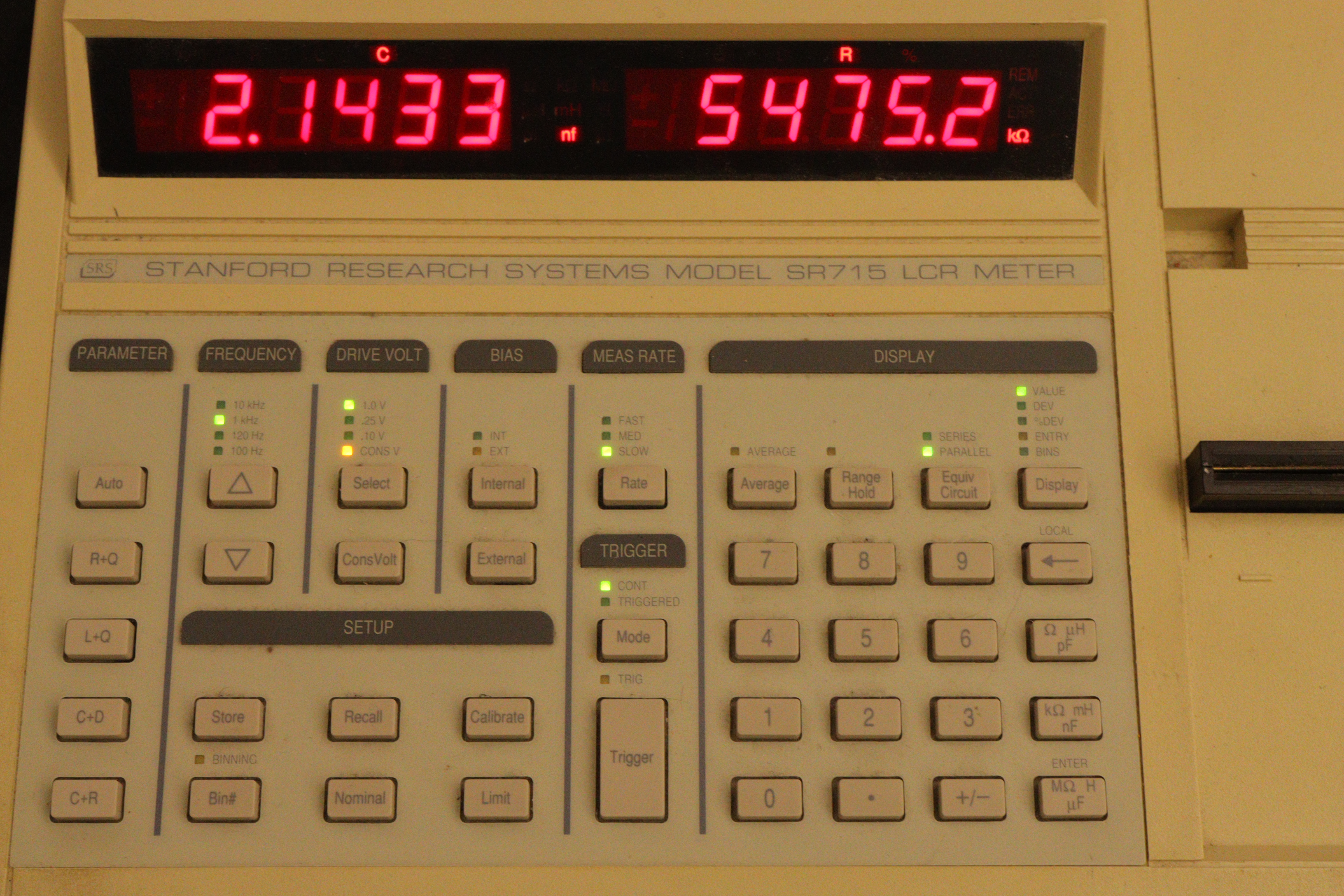 Front panel of the LCR measurement bridge showing parameter selection buttons, frequency controls, and measurement display.